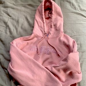It is a small champion pink and white hoodie